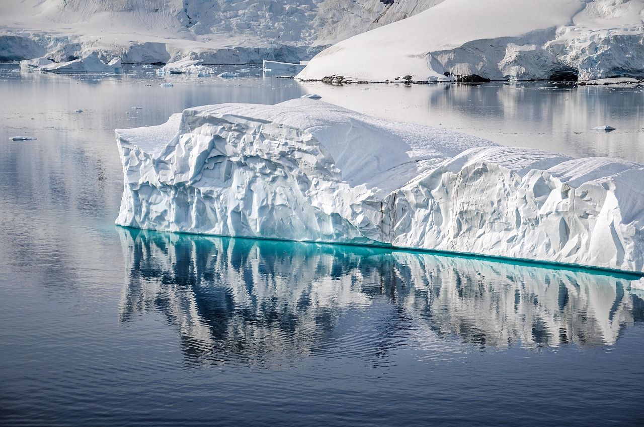 Iceberg reflected in a calm sea