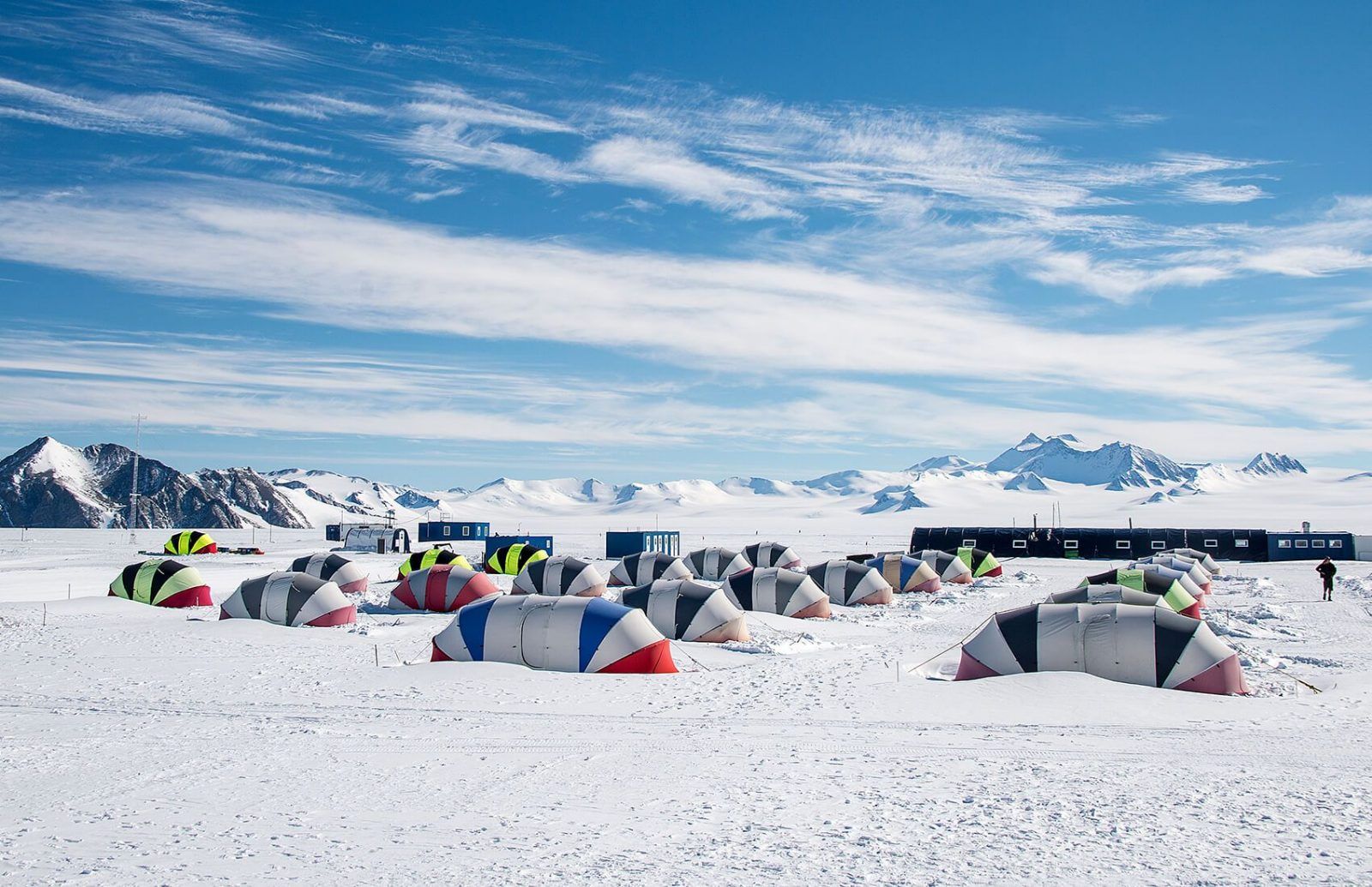 A field camp of domed tents on the ice