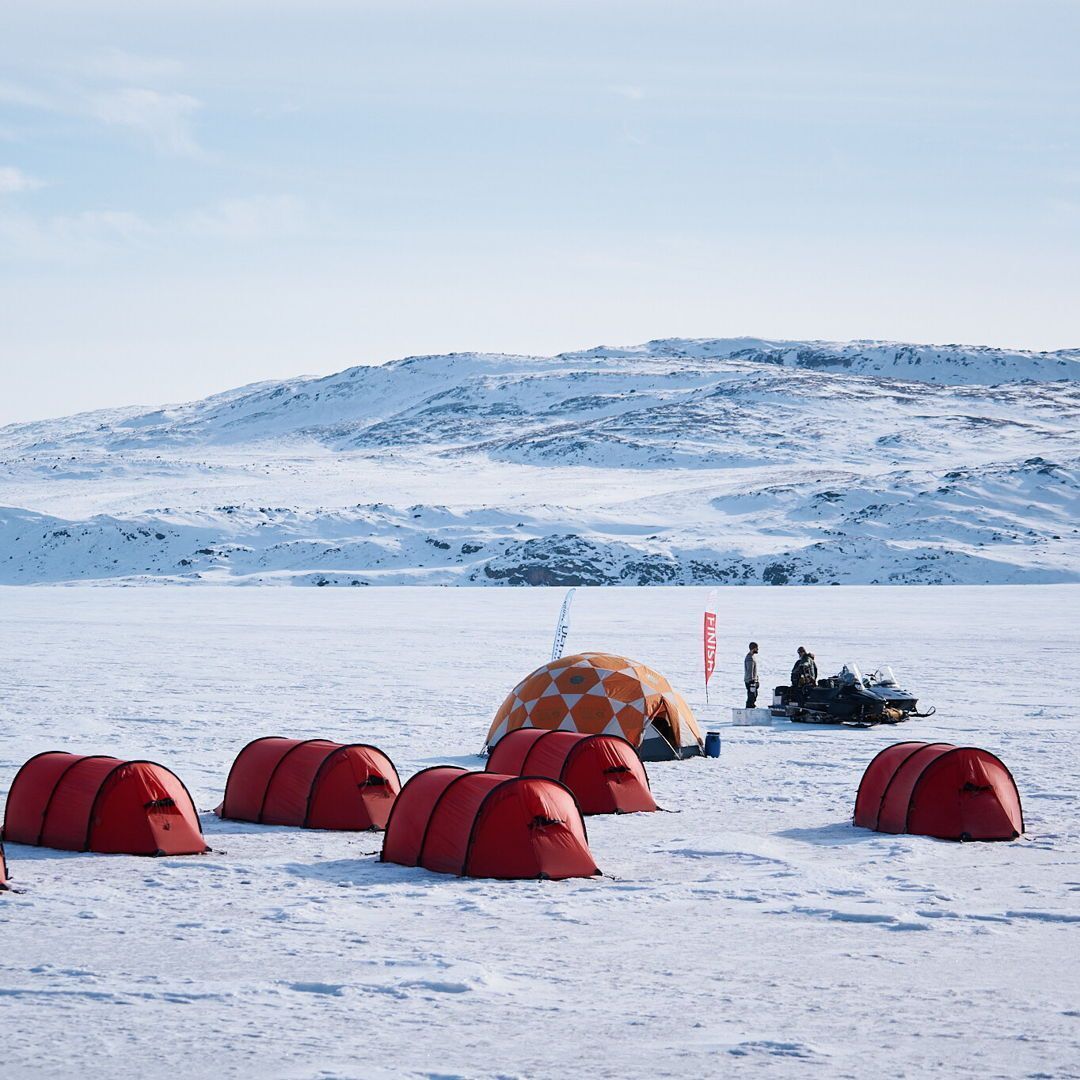 Red tents and a dome on the ice