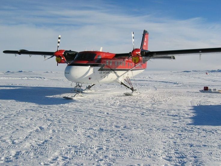 Twin-engine ski plane parked on snow