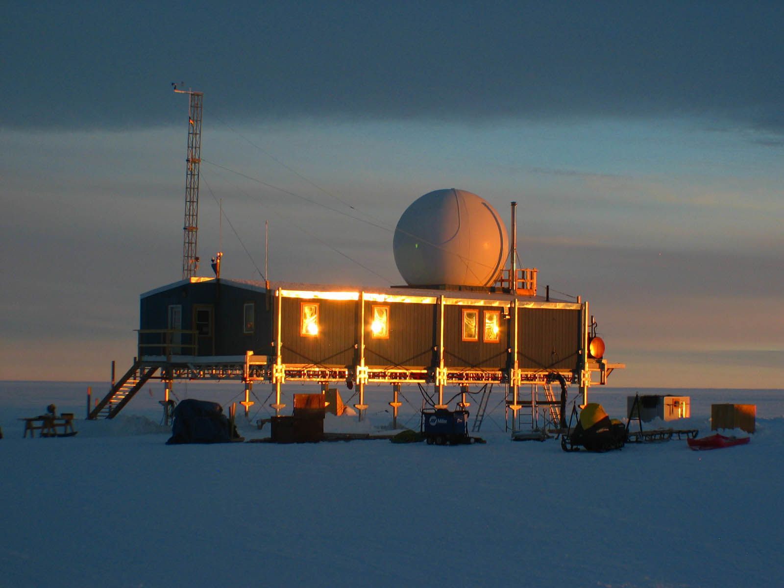 Field station with a radome at dusk