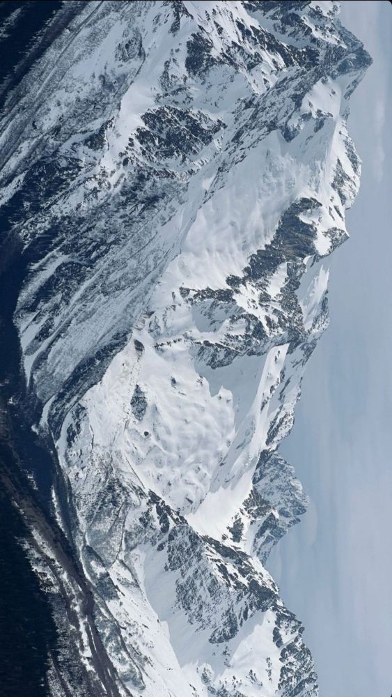 Steep snow face in shadow