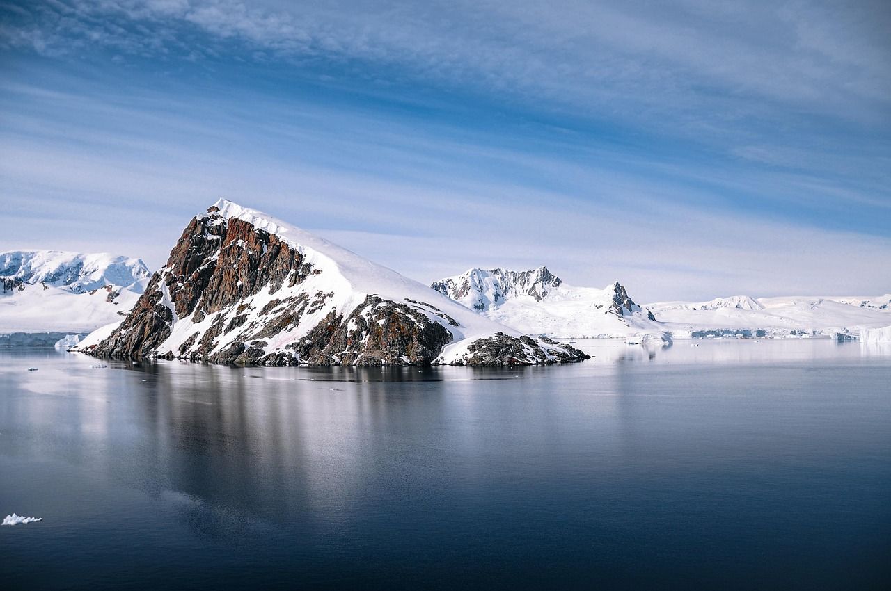 Rocky island in a still bay