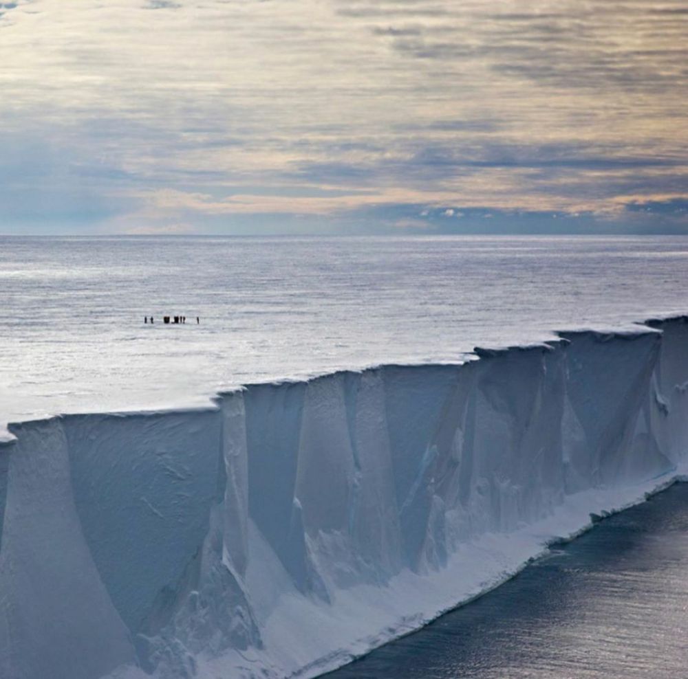 Ice shelf edge under a hazy sky