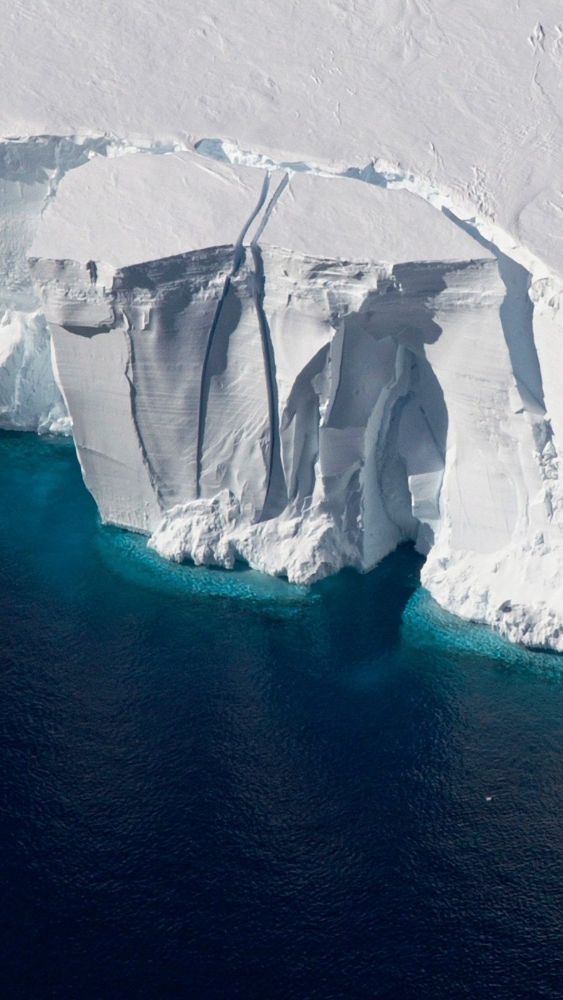 Ice shelf wall above dark water