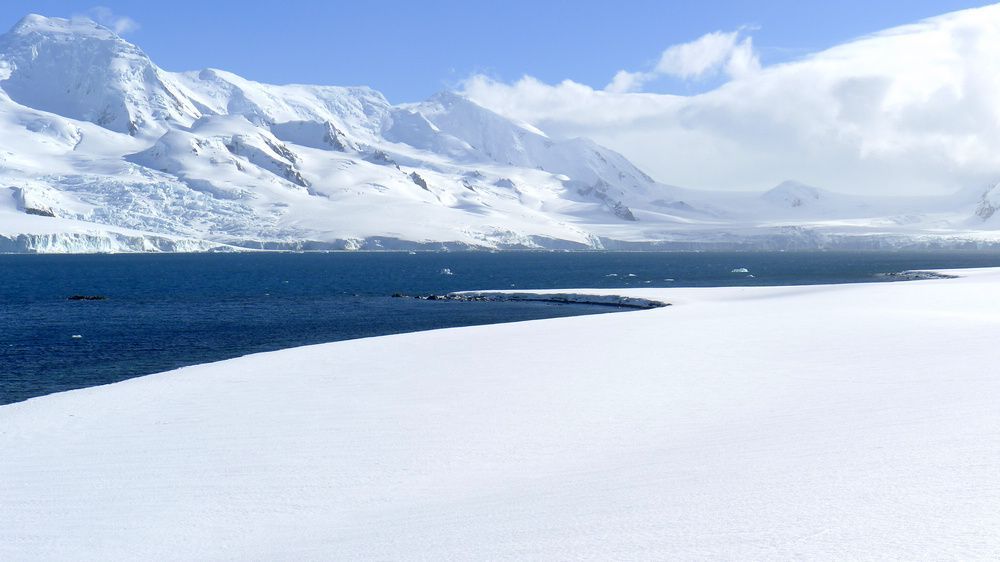 Snowfield meeting a blue sky