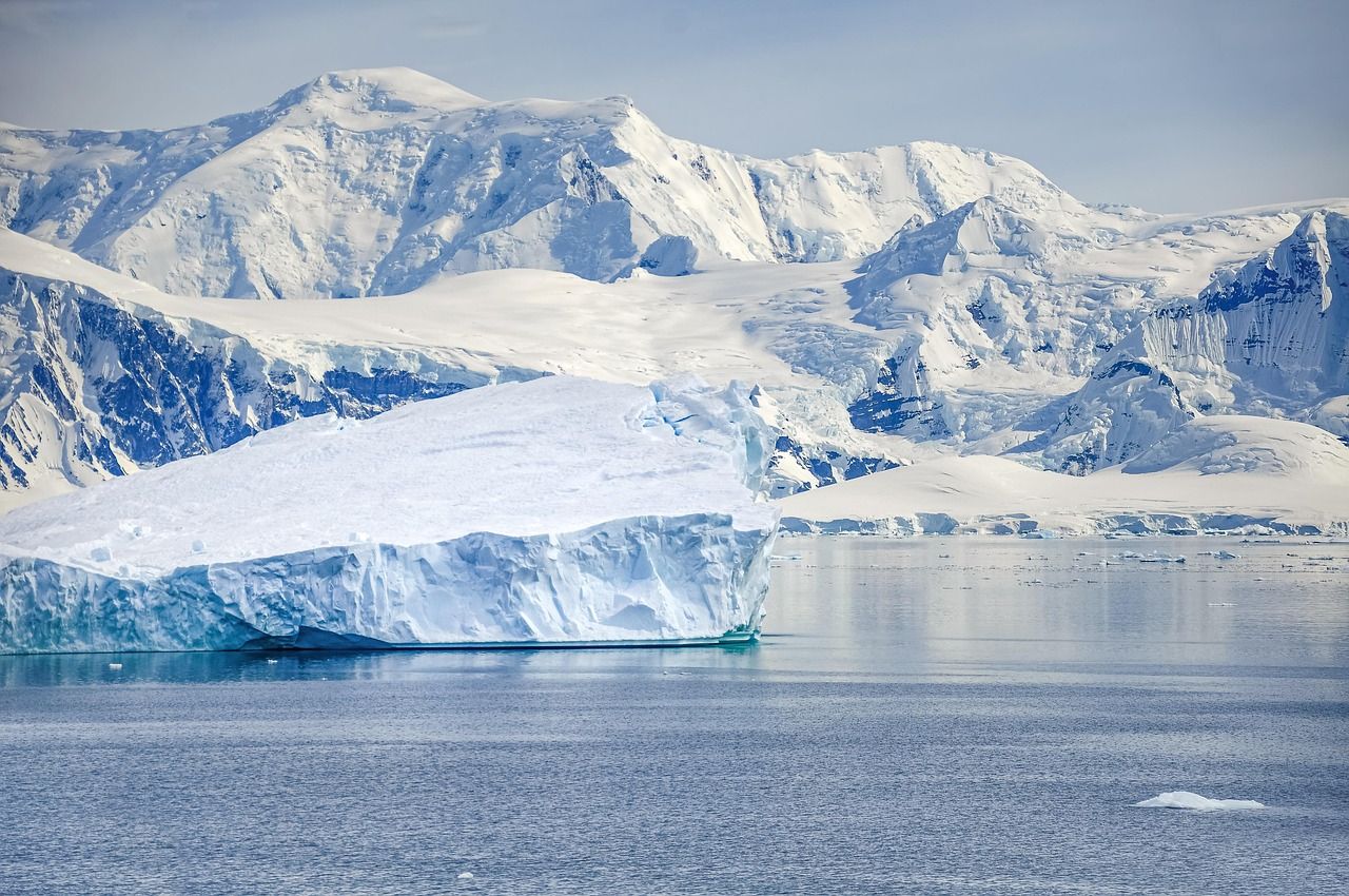 Glacier front below a snowy range