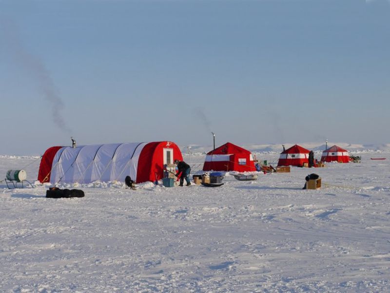 Red expedition tents on the ice