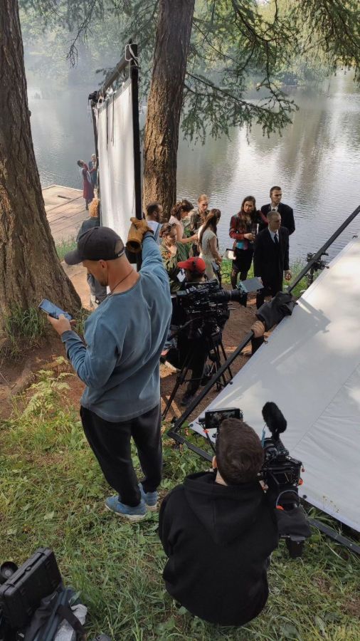 Crew and camera in a forest clearing
