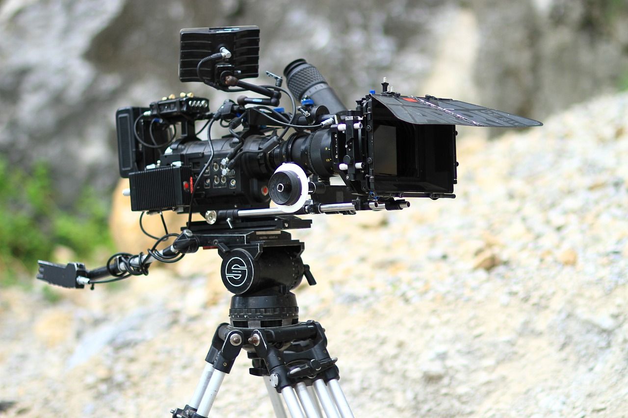 Cinema camera on a tripod outdoors