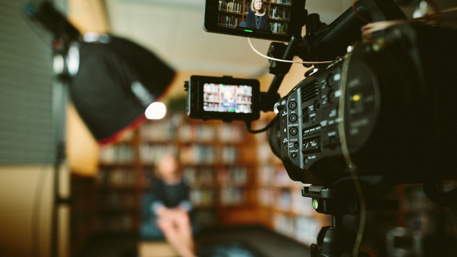 Camera framing an interview in a library