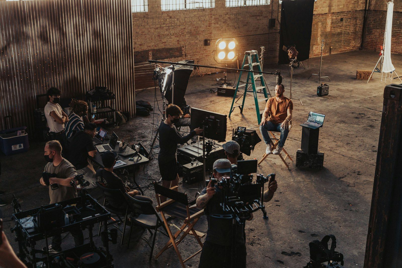 Crew filming in a warehouse