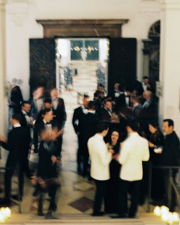 Guests arriving through a doorway at an event