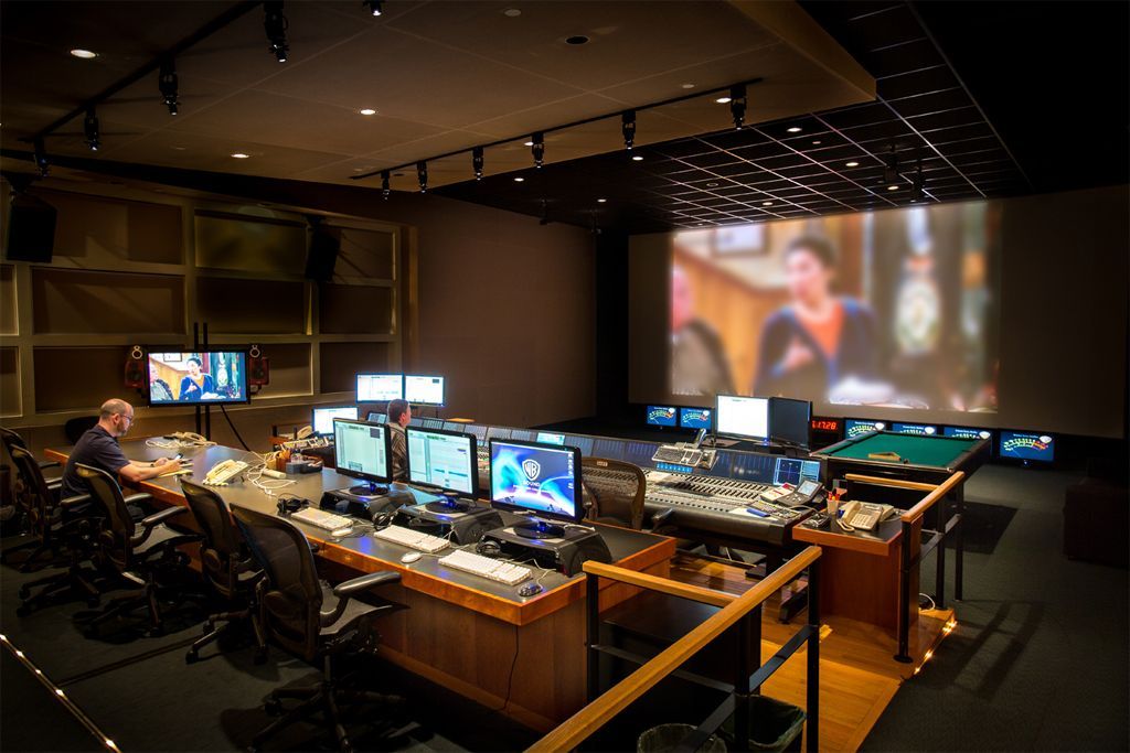 Edit suite facing a large projection screen