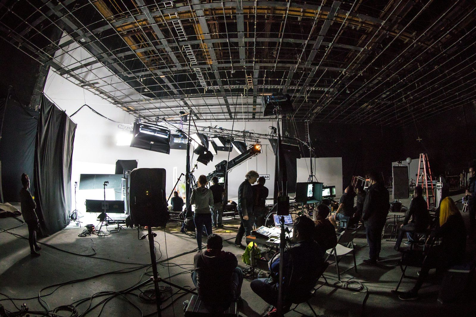 Crew working on a lit studio stage