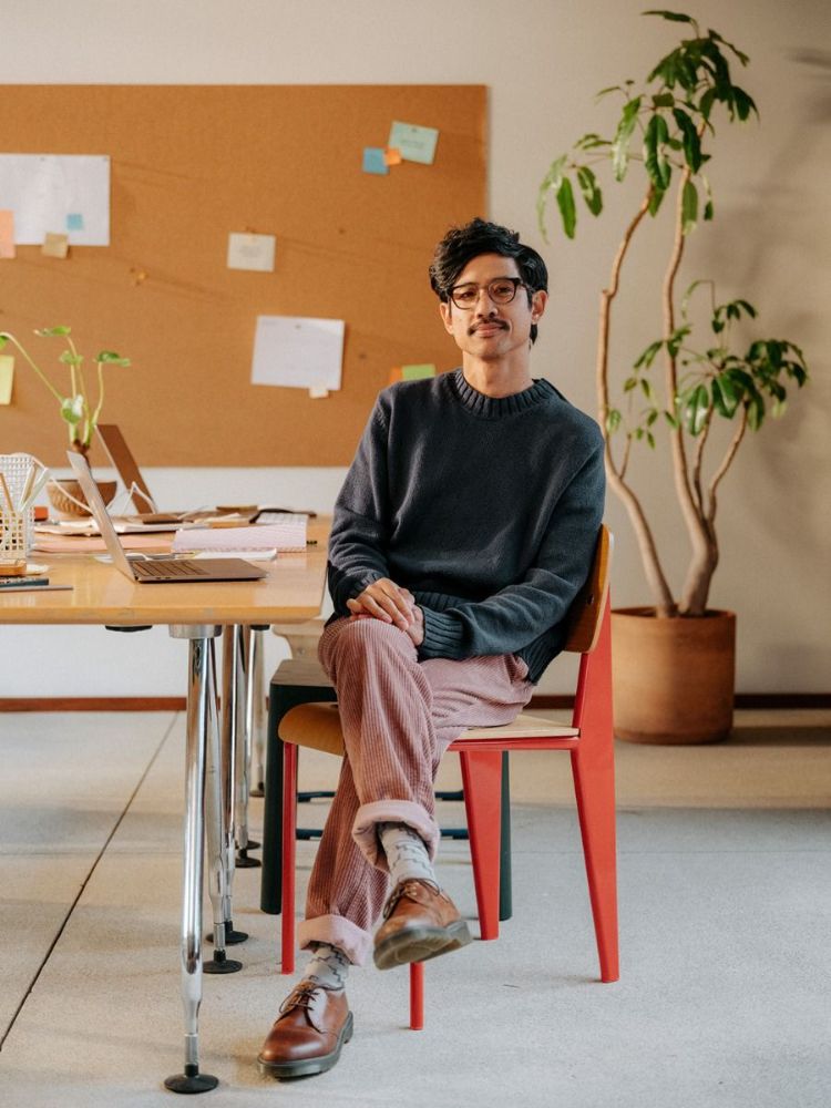 Engineer sitting at a desk in a bright office
