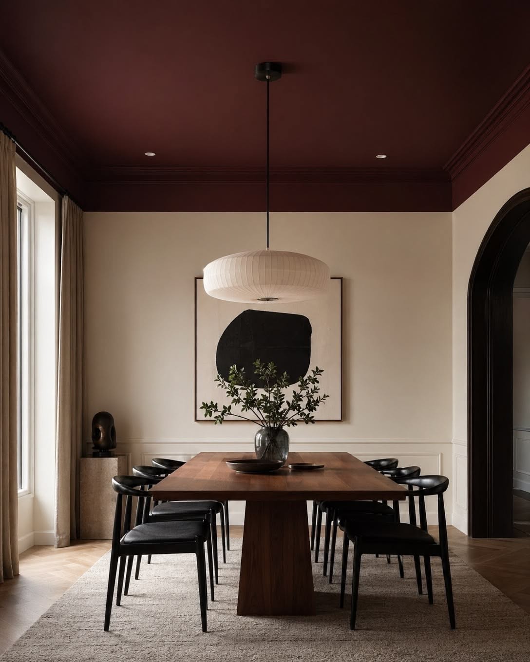Dining room with a plum ceiling and long wooden table