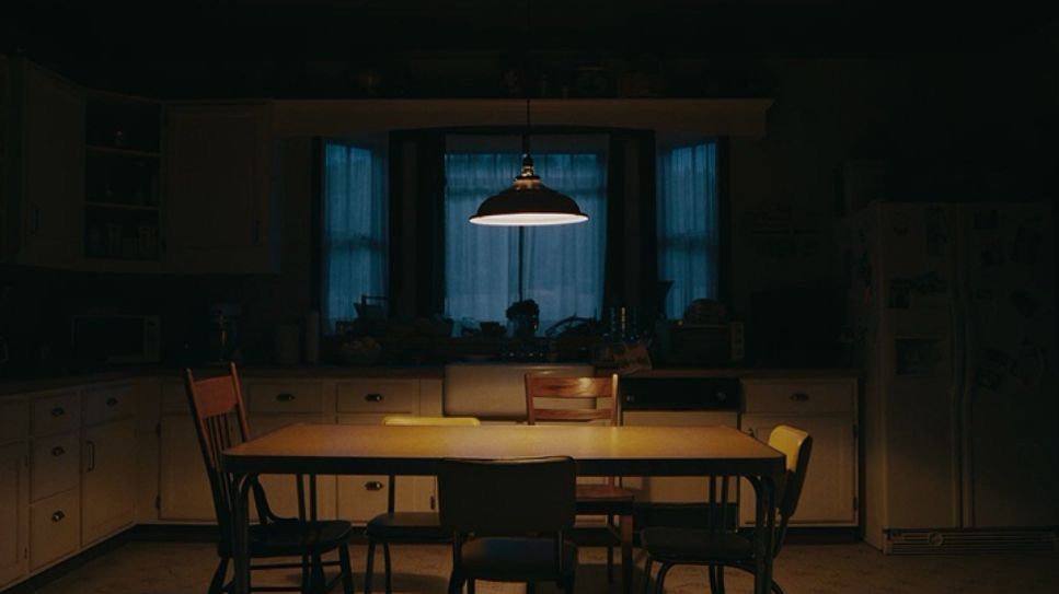 Dining room at dusk under a single pendant