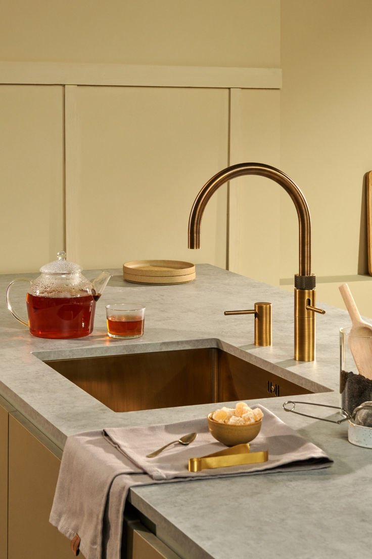 Brass tap over a marble sink