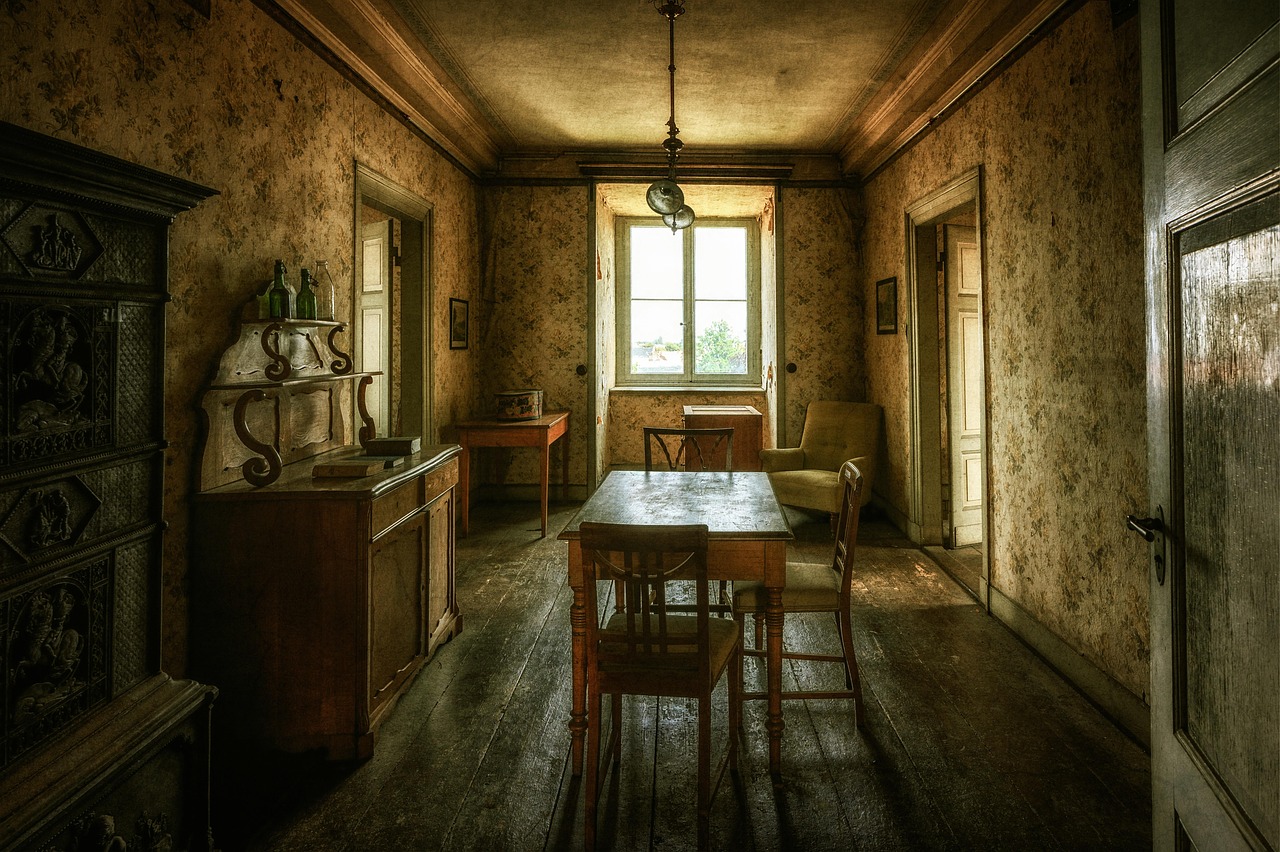 Old dining room with patterned wallpaper