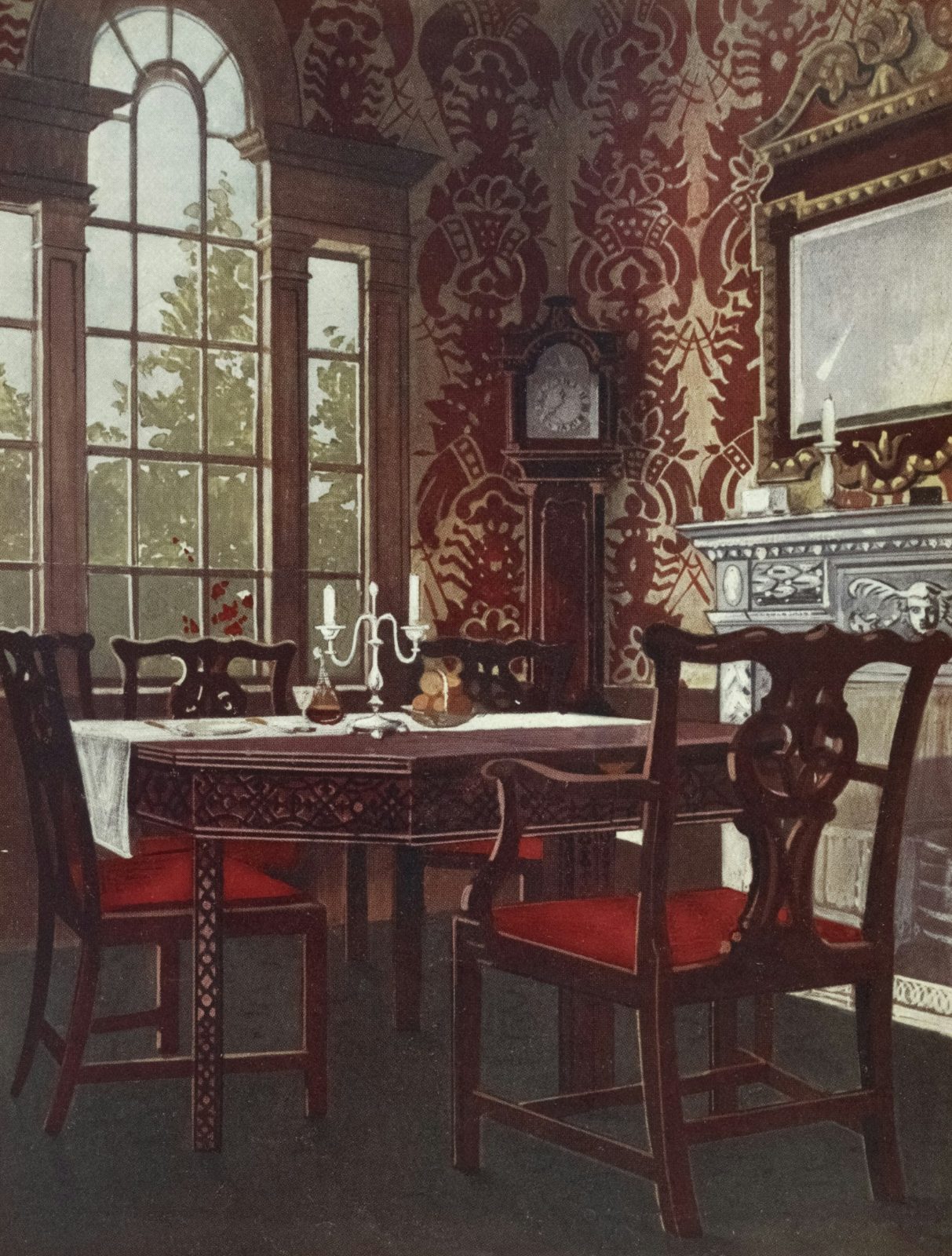 Red damask dining room with carved chairs