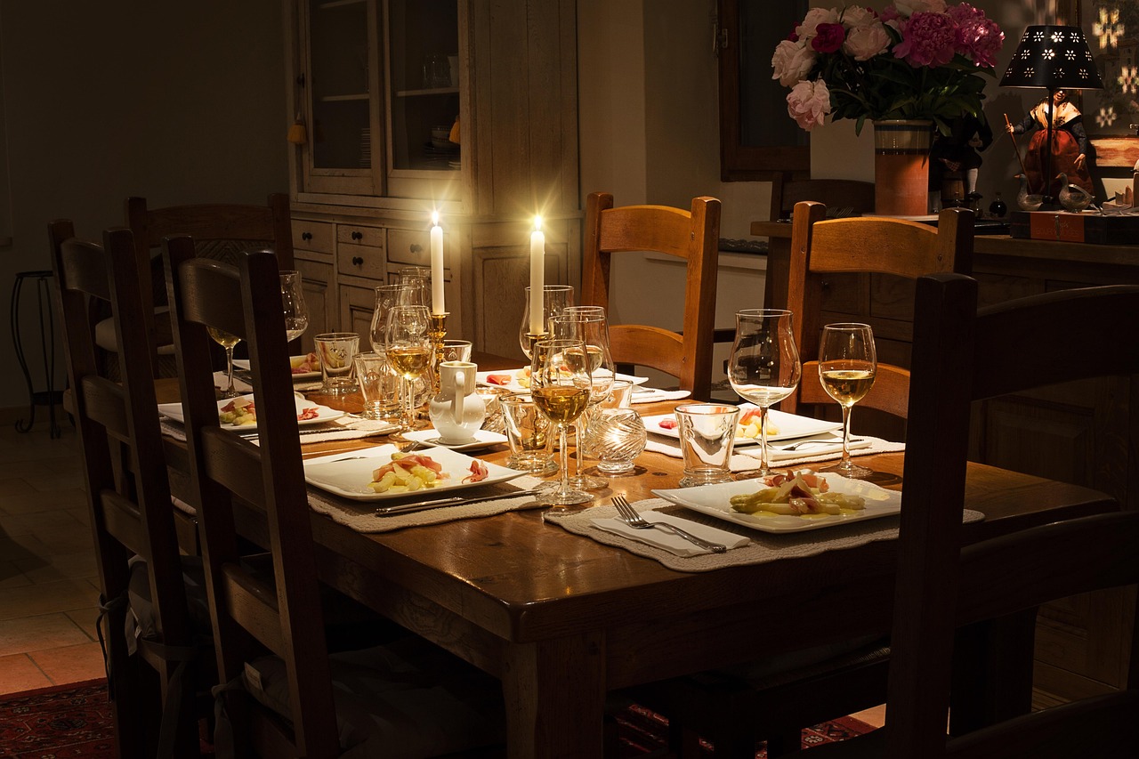 Candlelit dinner table with glasses