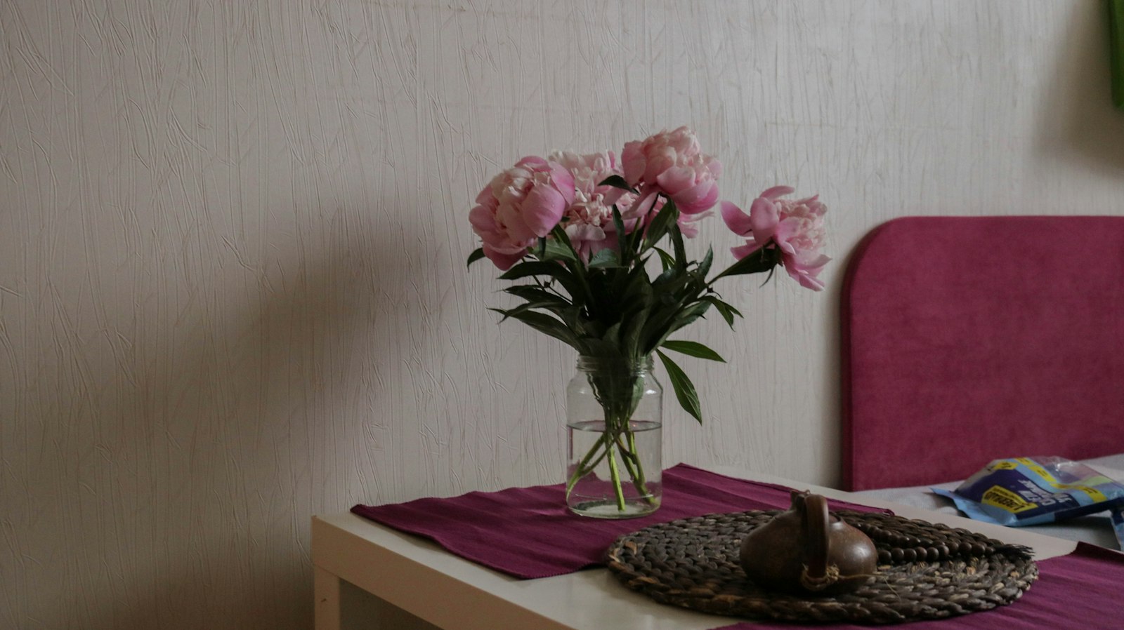 Peonies in a glass vase
