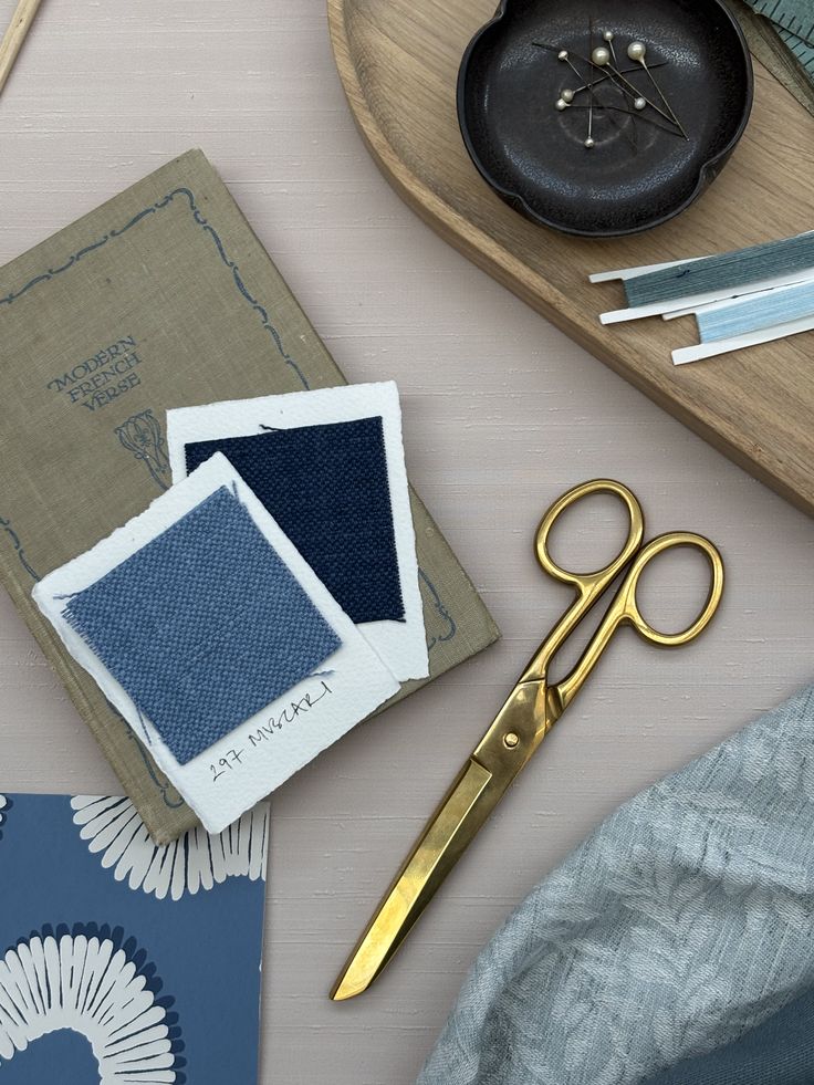 Fabric samples and brass scissors