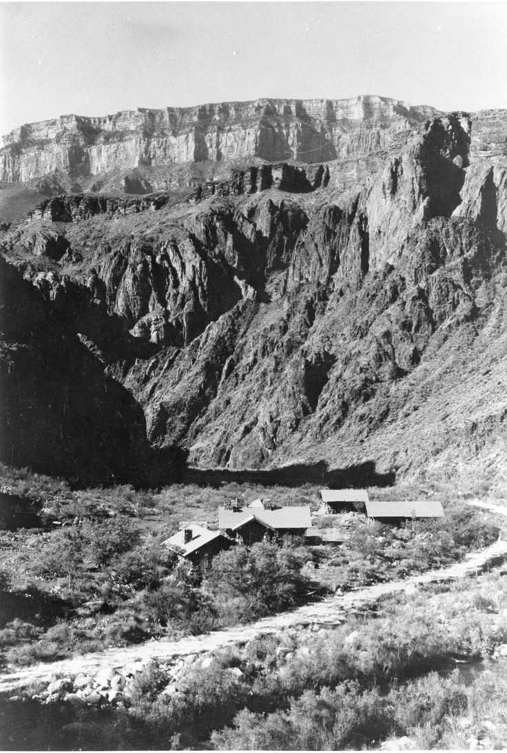 Cabins below a canyon wall