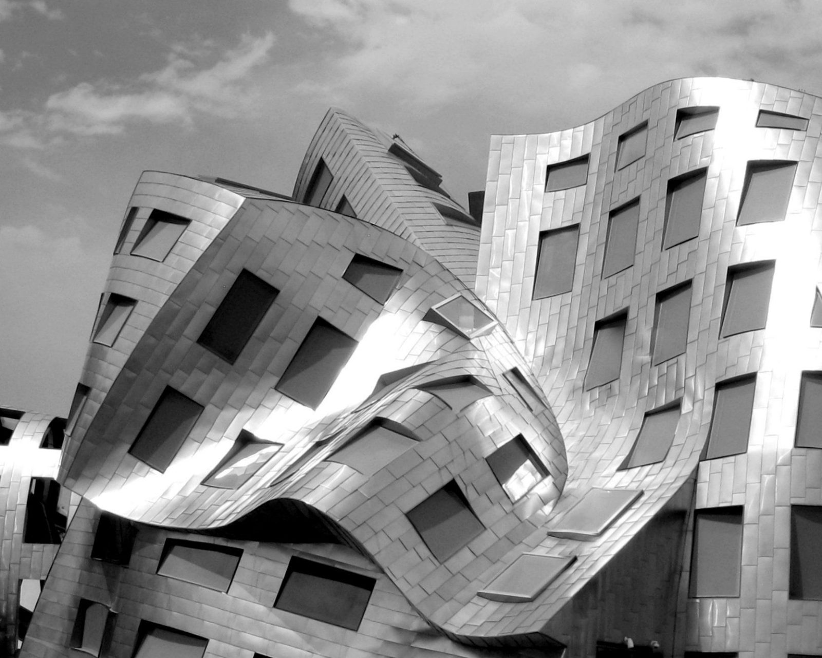 Folded steel facade with punched windows