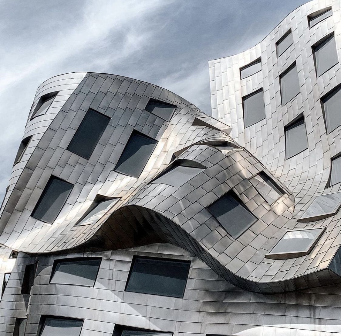 Rippled steel facade against the sky
