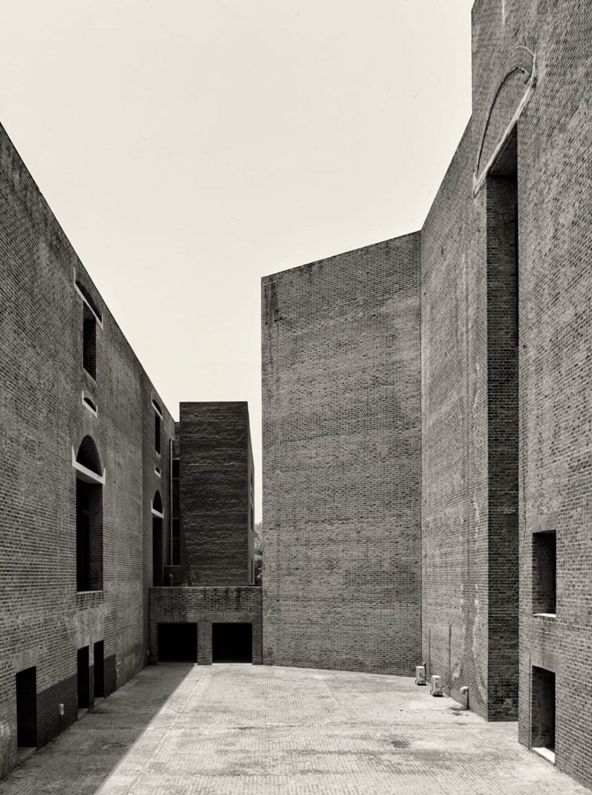 Brick walls and a narrow court