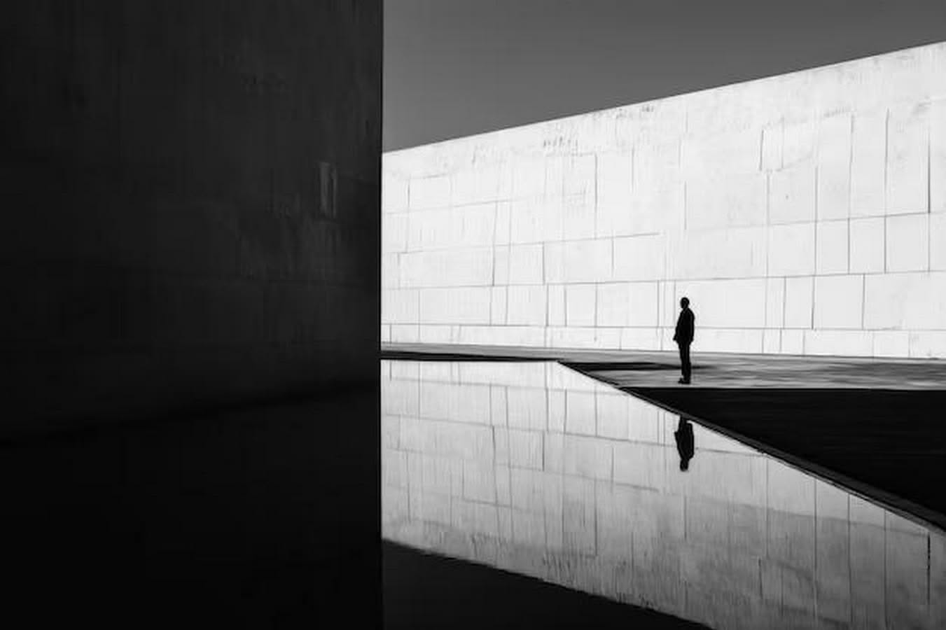 Travertine wall beside a reflecting pool