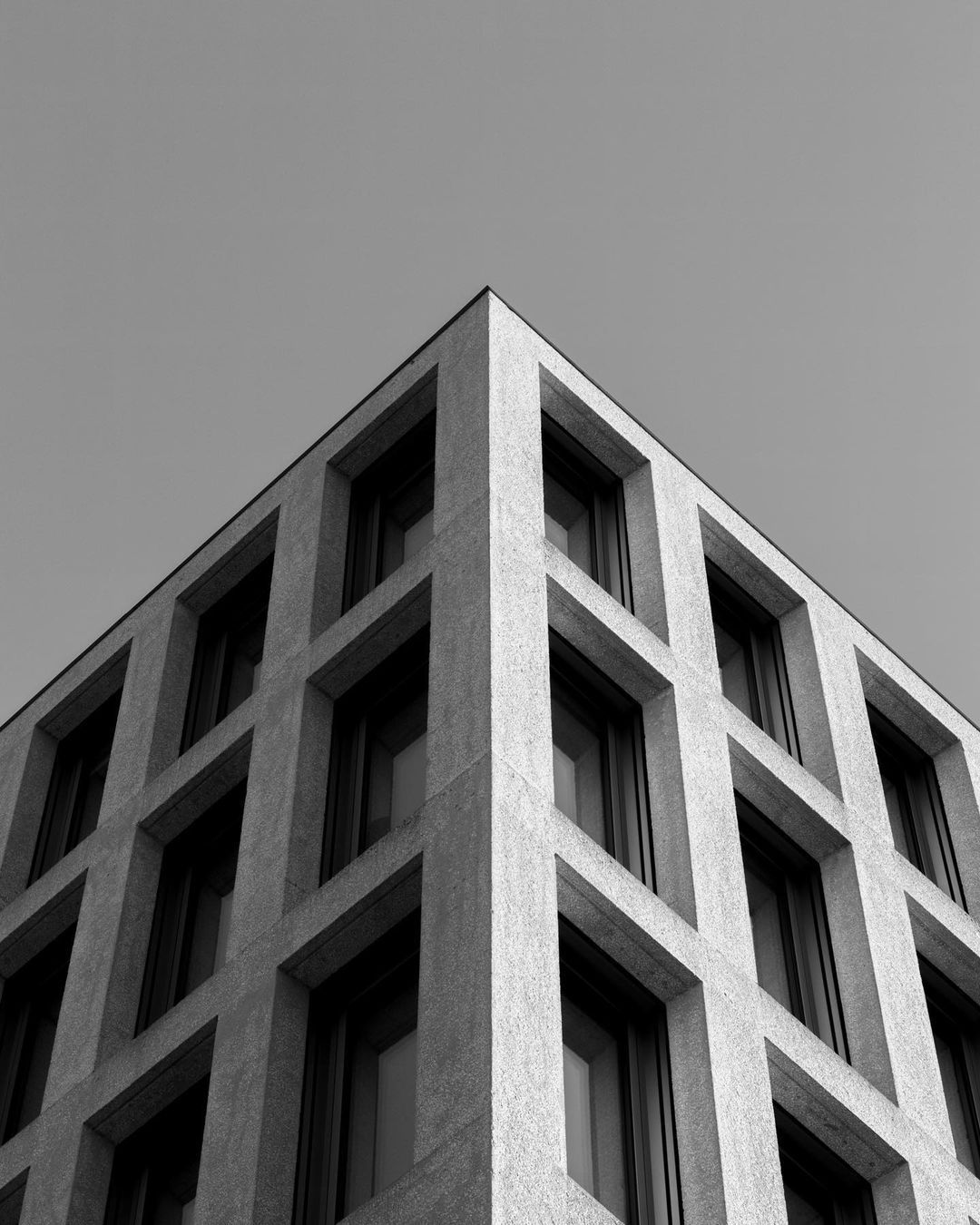 Stone facade with deep square windows