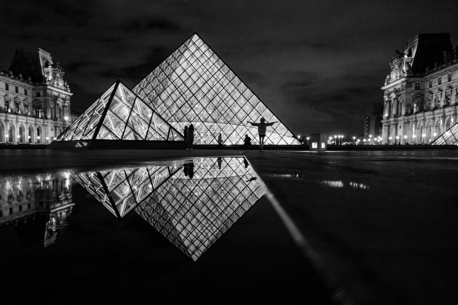Louvre Pyramid reflected at night