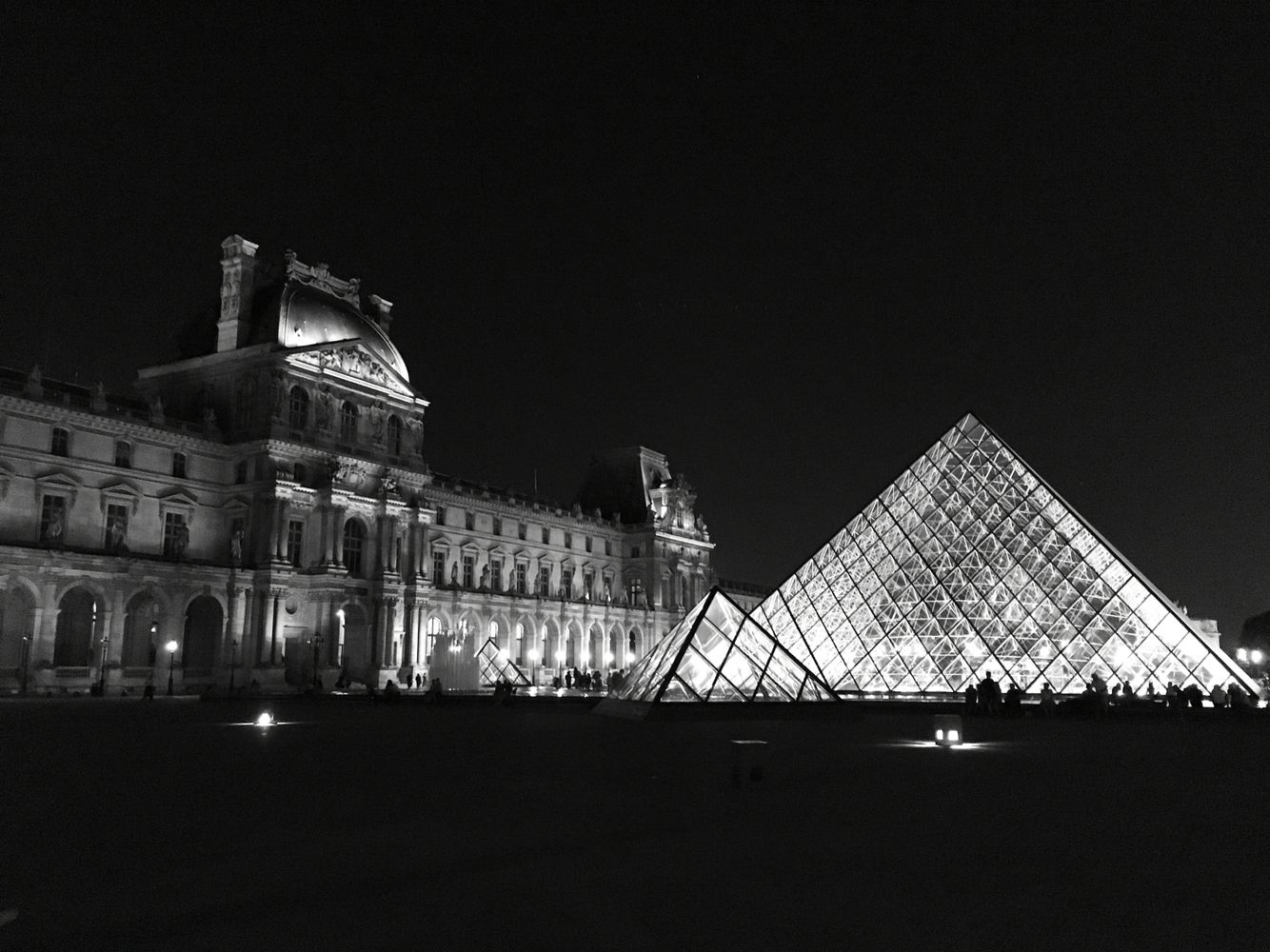 Louvre Pyramid and palace at night