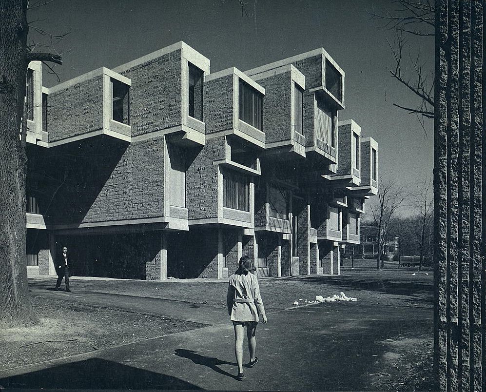 Stacked brick units above a lawn