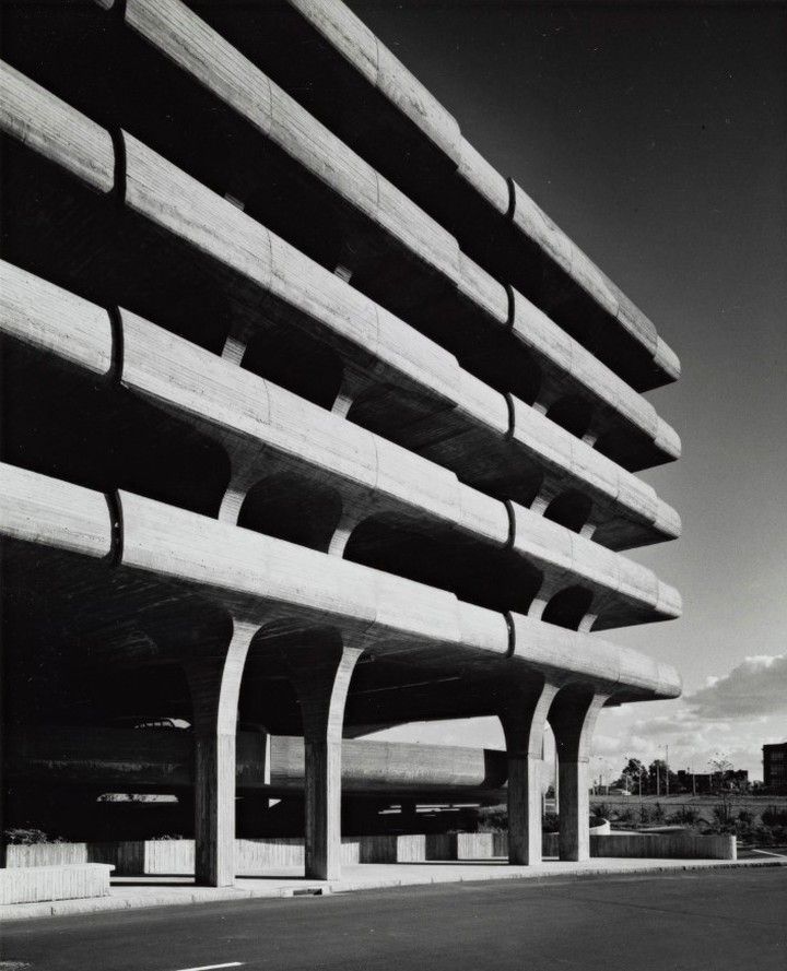 Parking deck with curved concrete trays
