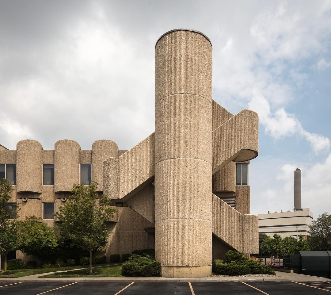Brick stair tower beside a car park