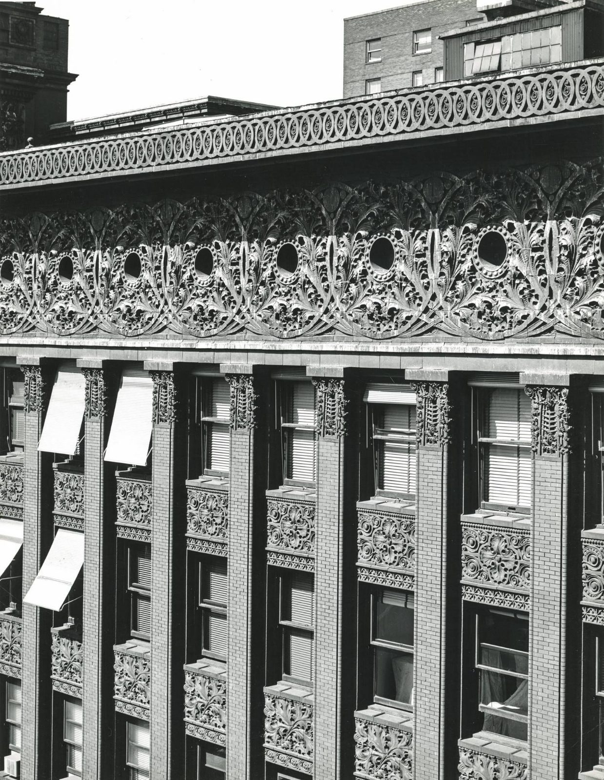 Terracotta frieze above a colonnade