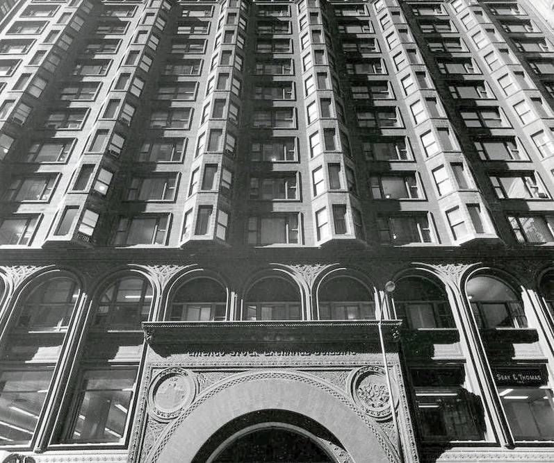 Arched entrance under terracotta bays