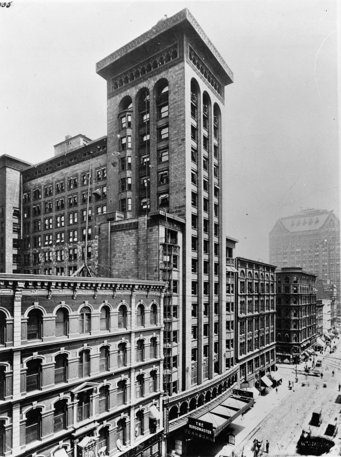 Office tower above a street of loft buildings