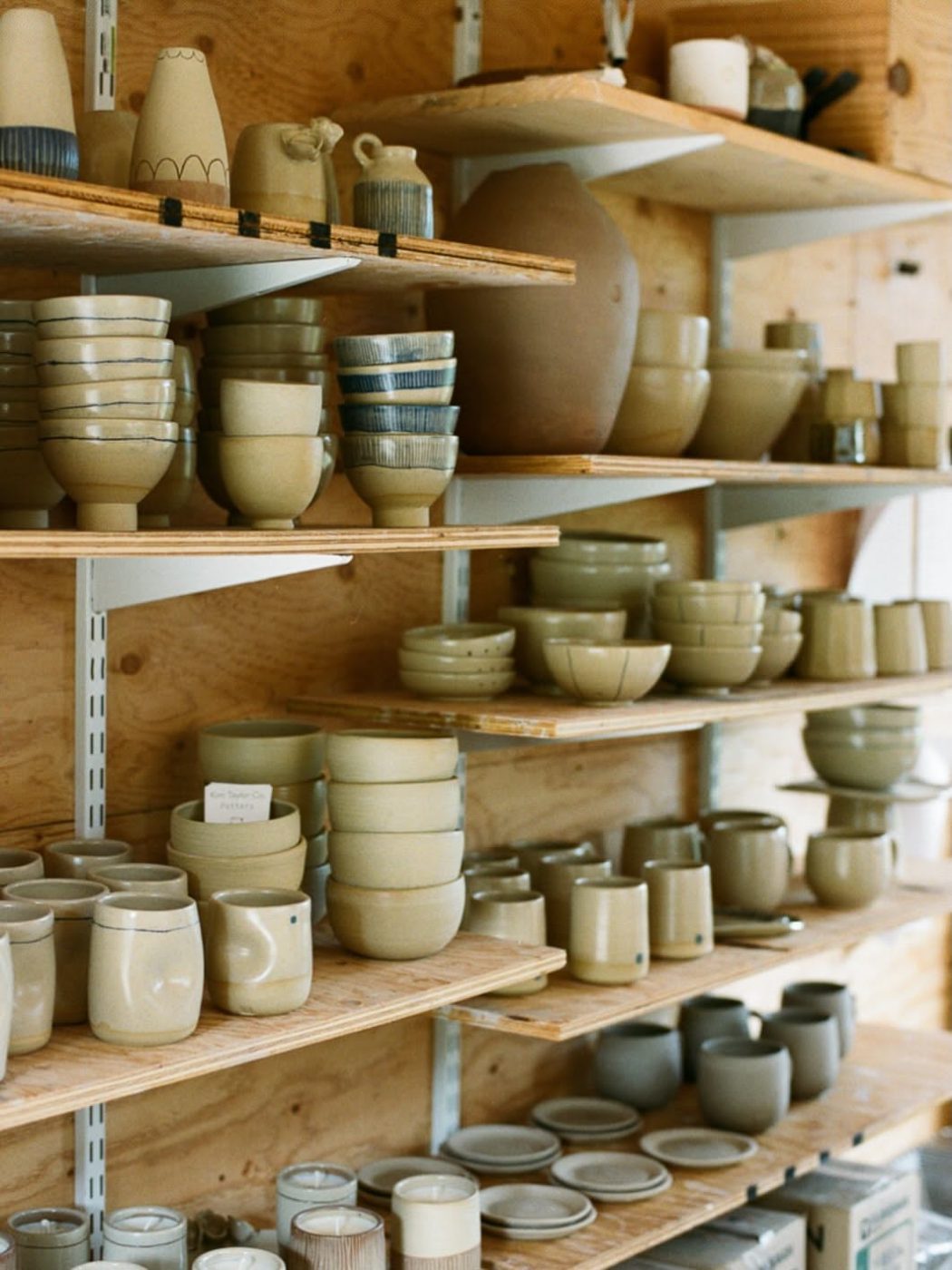 Shelves of glazed cups and jars