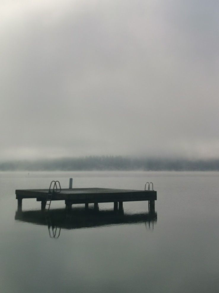 Swimming raft on the lake in thick fog
