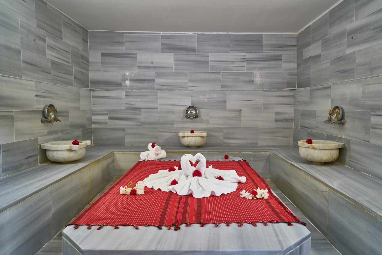 Marble steam room with three basins