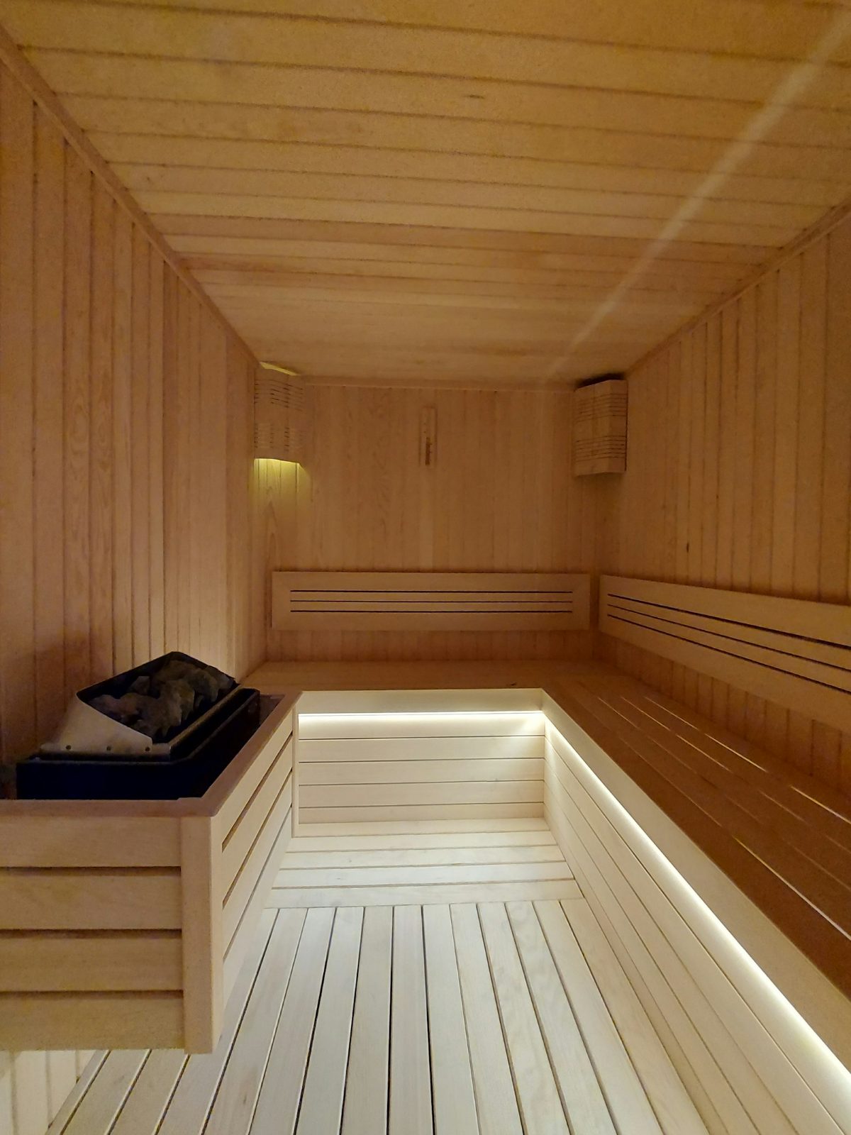 Pale wooden rest room beside the steam room