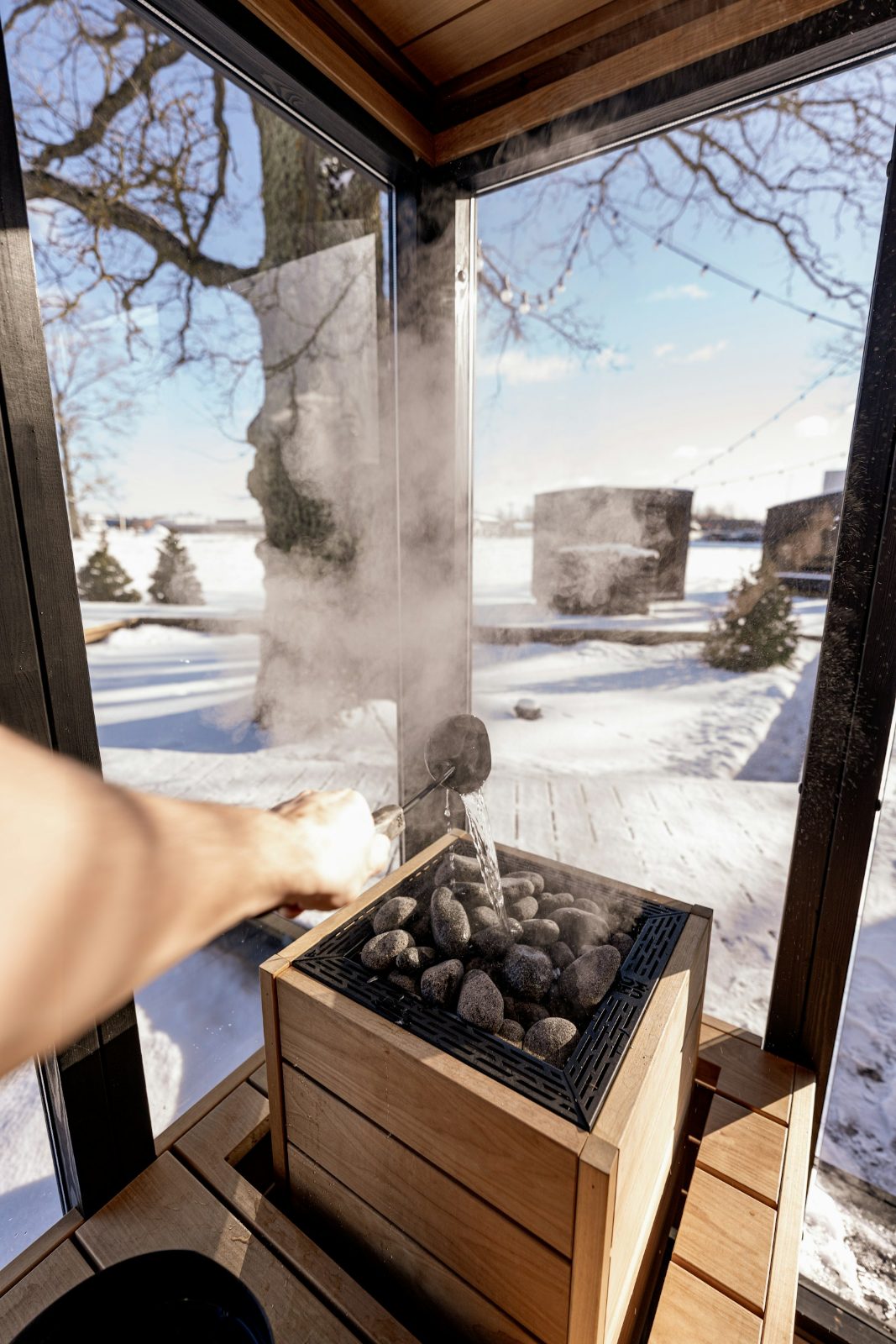 Water thrown on the stones with snow outside the open door