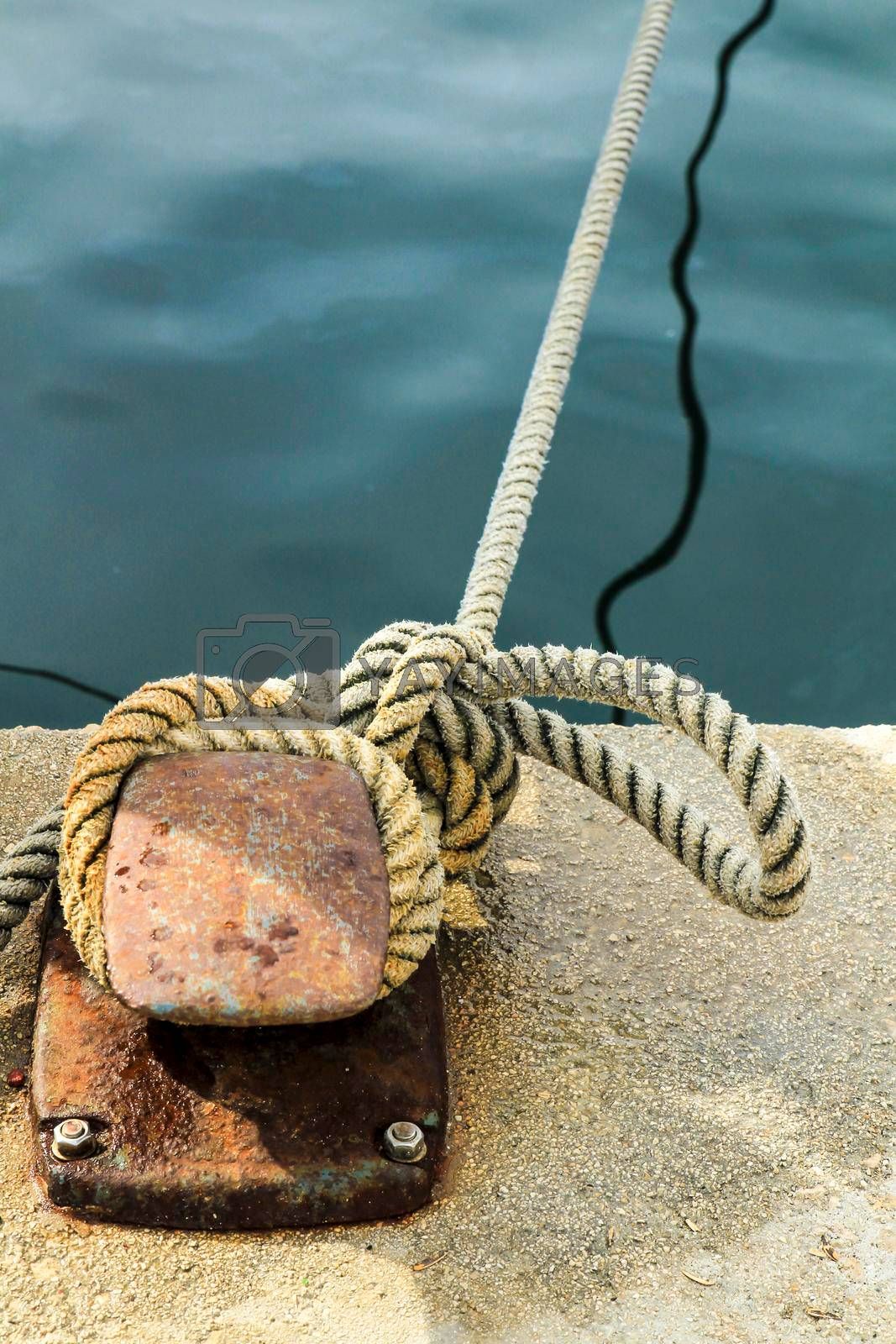 A mooring line made fast on a quay bollard