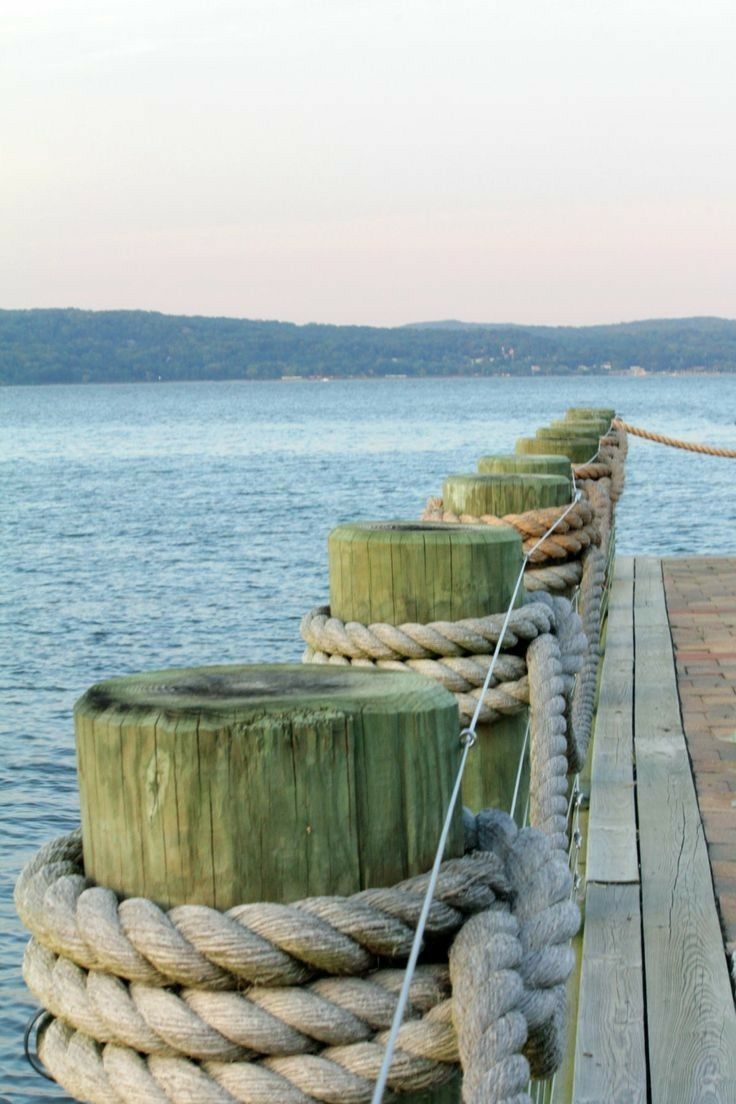 Pontoon posts wrapped in mooring rope