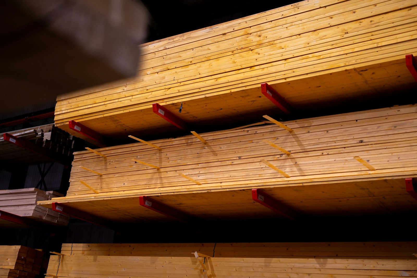 Sawn boards on cantilever racks inside a timber store